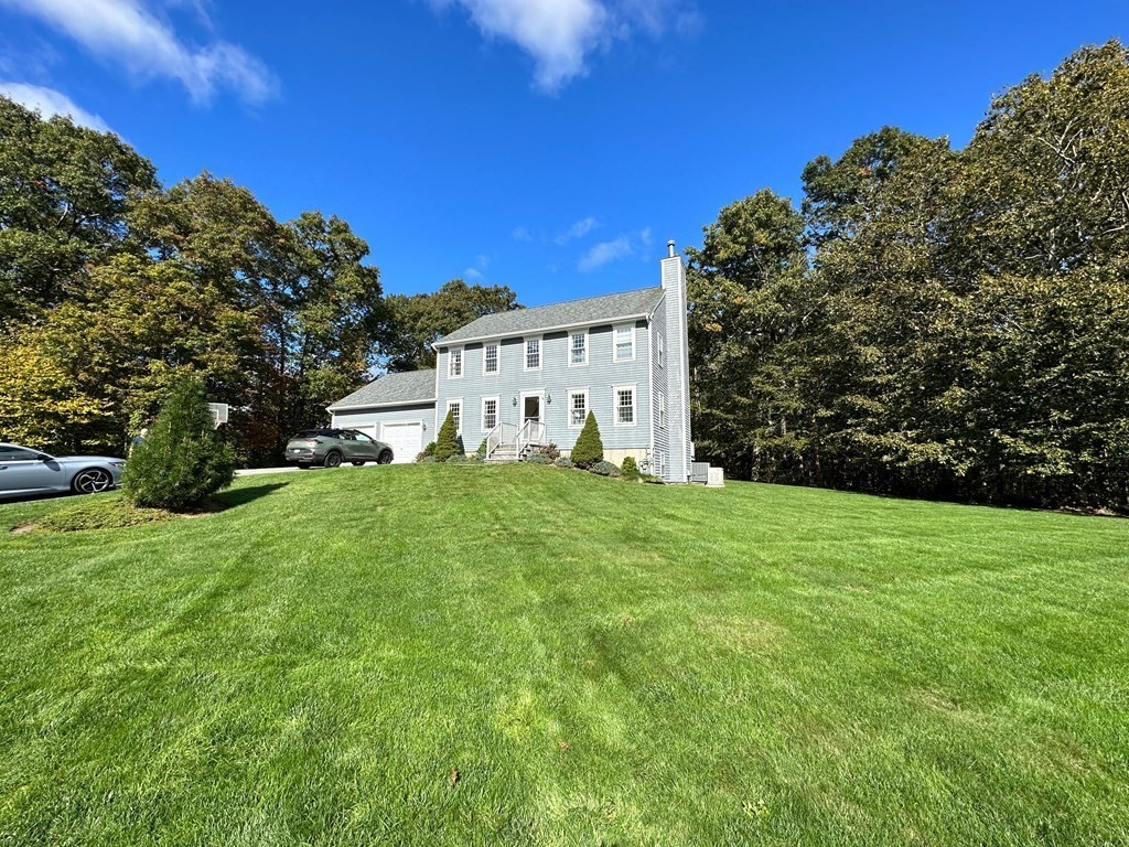 76 Jillian Way Westport, MA 02790 - Photo 1 of 23 a view of a house with backyard and garden
