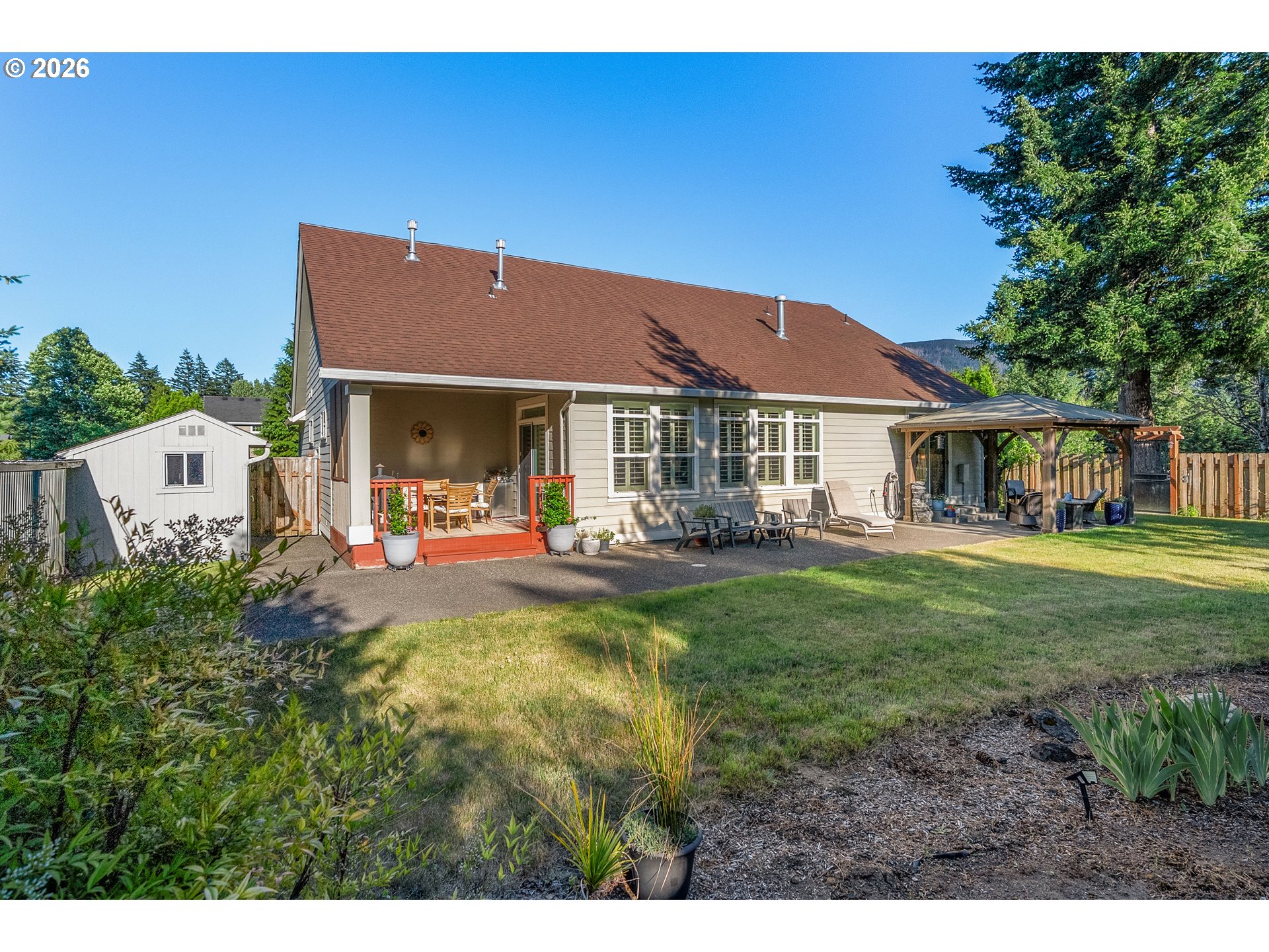 945 Northwest Angel Heights Road Stevenson, WA 98648 - Photo 29 of 41 a front view of a house with yard porch and furniture