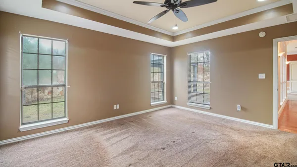 a view of an empty room with a window