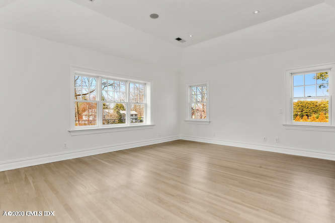 60 Club Road Riverside, CT 06878 - Photo 22 of 44 a view of an empty room with window and wooden floor