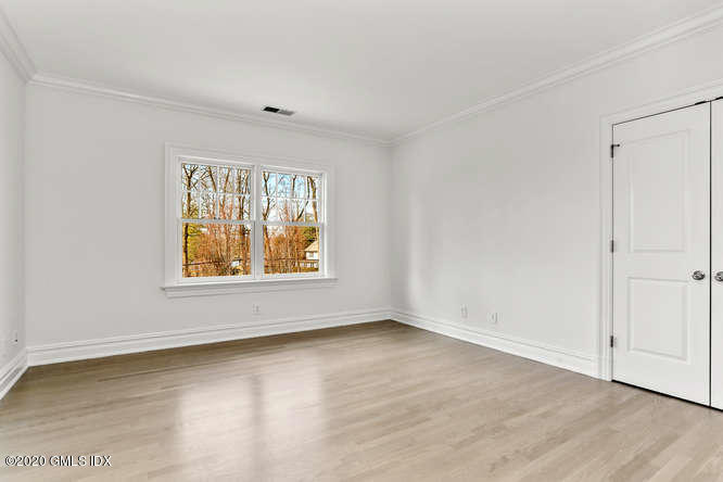 60 Club Road Riverside, CT 06878 - Photo 29 of 44 an empty room with wooden floor and windows