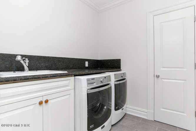 60 Club Road Riverside, CT 06878 - Photo 30 of 44 a view of a storage and utility room with washer and dryer