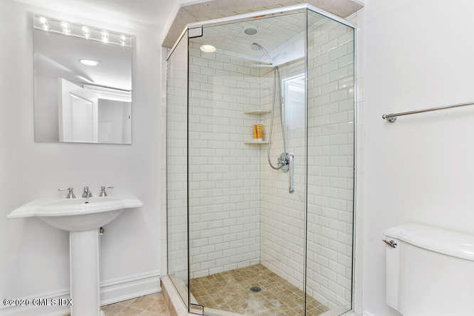 60 Club Road Riverside, CT 06878 - Photo 31 of 44 a bathroom with a sink mirror and shower
