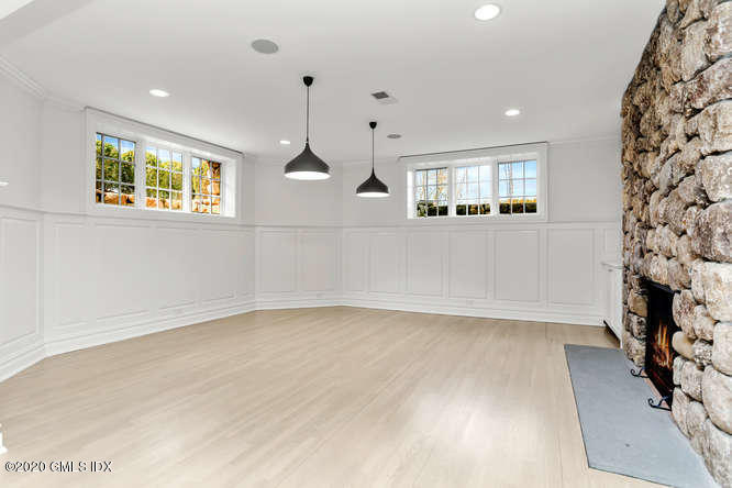 60 Club Road Riverside, CT 06878 - Photo 35 of 44 an empty room with chandelier fan and windows