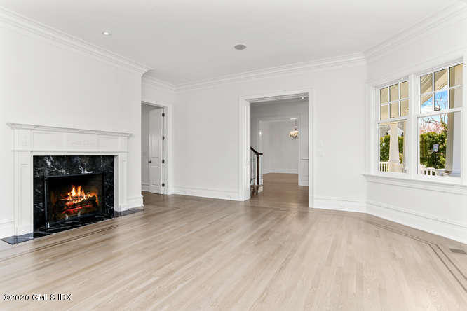 60 Club Road Riverside, CT 06878 - Photo 6 of 44 a view of an empty room with wooden floor fireplace and a window