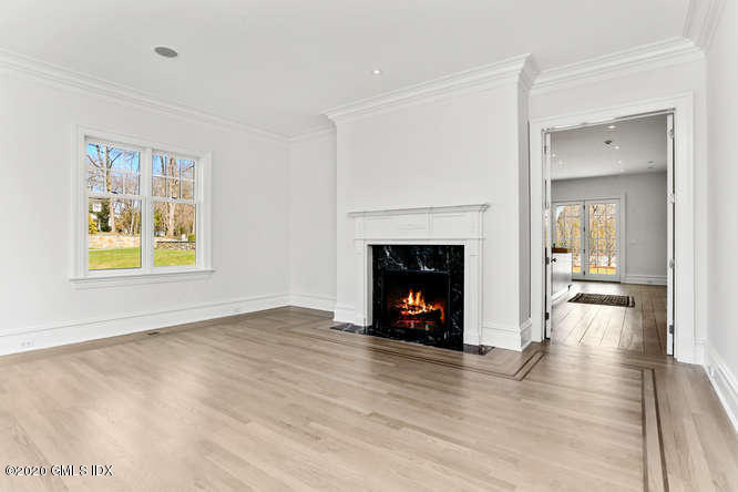 60 Club Road Riverside, CT 06878 - Photo 7 of 44 a view of an empty room with wooden floor fireplace and a window