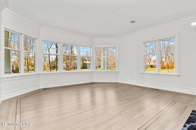 60 Club Road Riverside, CT 06878 - Photo 9 of 44 a view of an empty room with a window and wooden floor