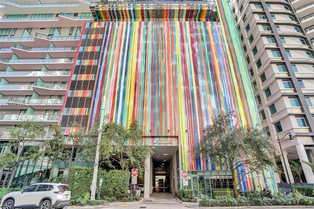 a view of a a dining room with furniture window and outside view