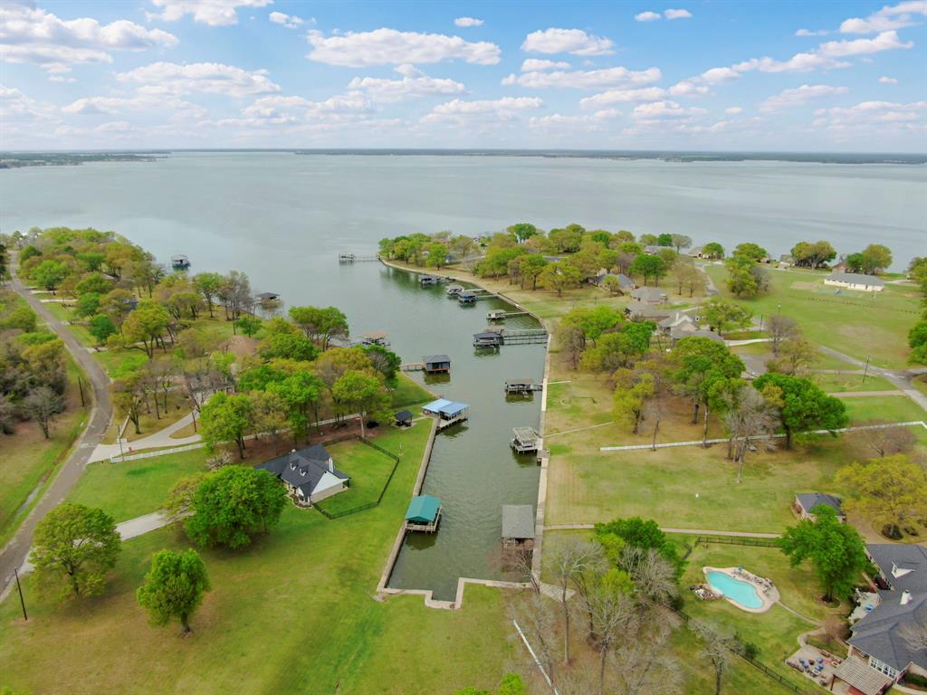 A2000 Azure Lane Streetman, TX 75859 - Photo 5 of 12 a view of a lake with a houses