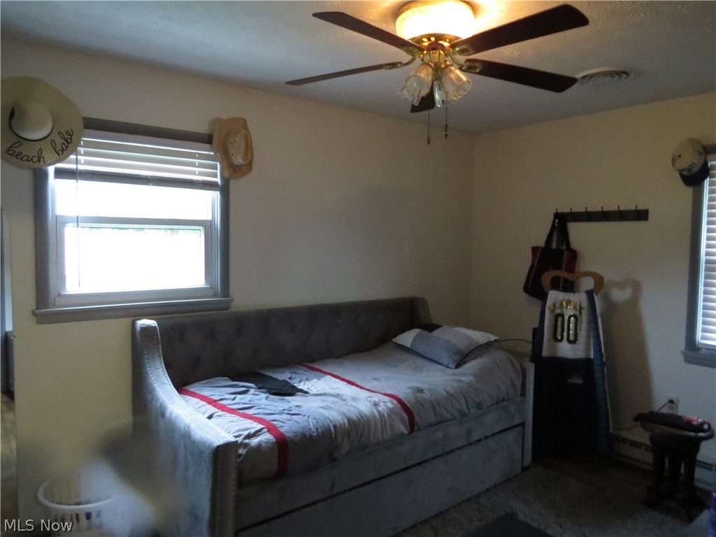 9811 Church Road Huron, OH 44839 - Photo 15 of 28 Bedroom featuring ceiling fan and carpet flooring