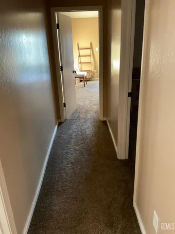 a view of a livingroom from a hallway