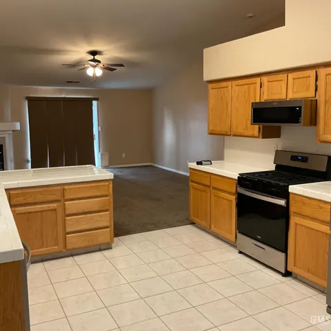 a kitchen with a sink stove and microwave