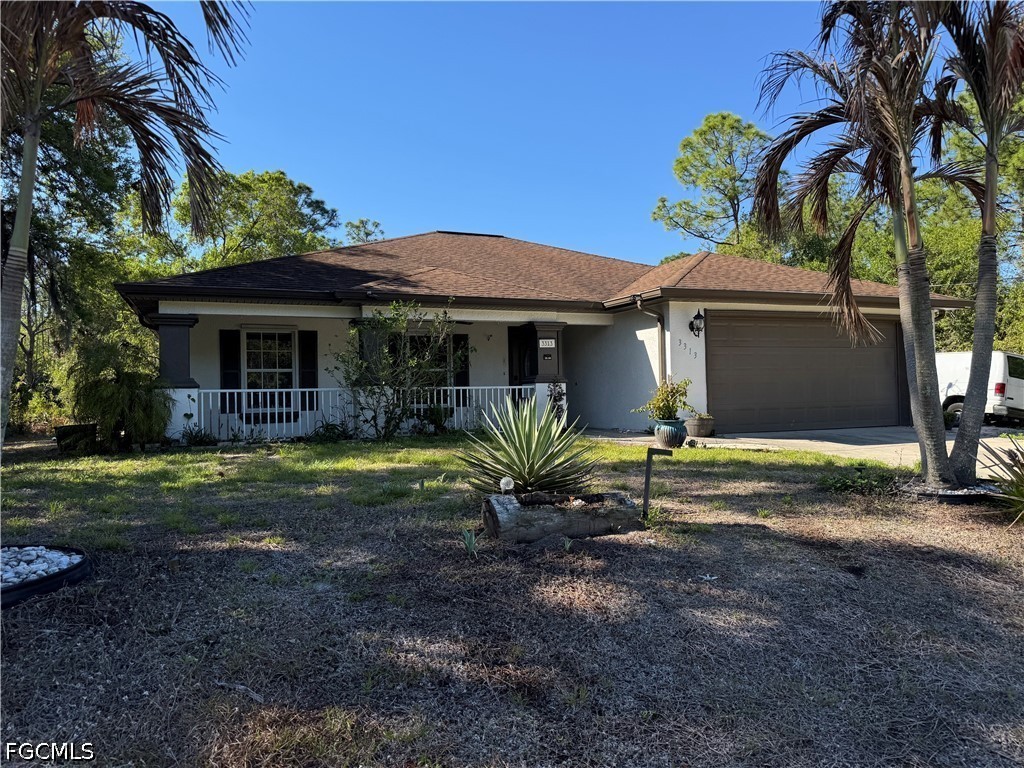 a view of a house with backyard and porch