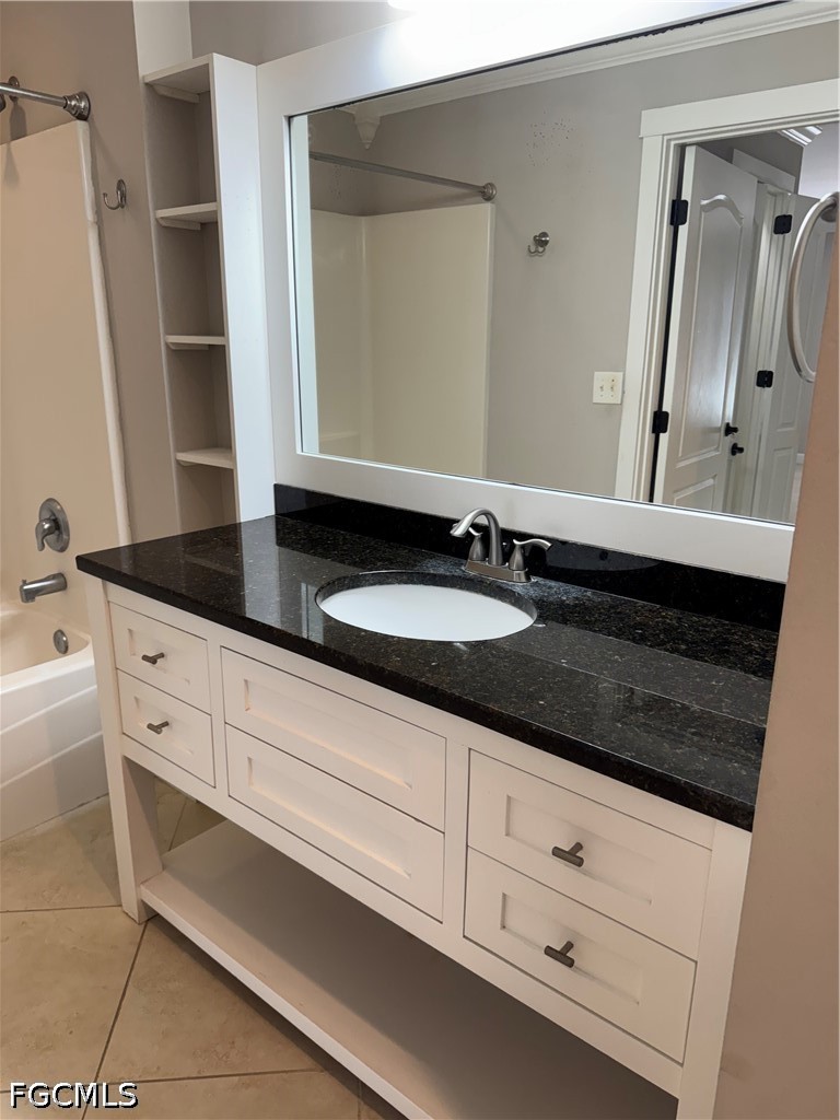 3313 35th Street West Lehigh Acres, FL 33971 - Photo 12 of 15 a bathroom with a sink and a mirror