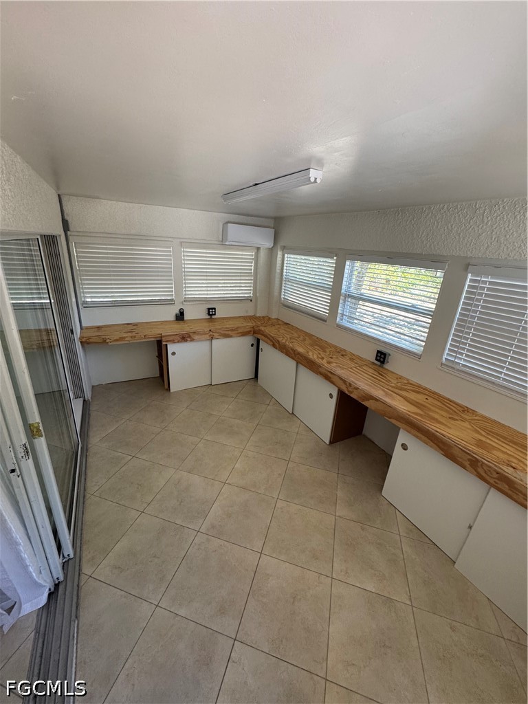 3313 35th Street West Lehigh Acres, FL 33971 - Photo 13 of 15 a view of an empty room with a window