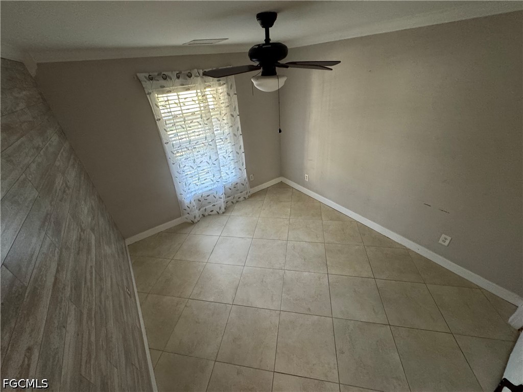 3313 35th Street West Lehigh Acres, FL 33971 - Photo 6 of 15 a view of an empty room and a window