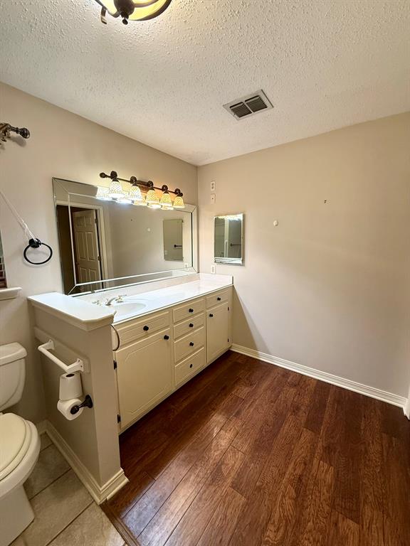 11535 Timber Ridge Drive Keithville, LA 71047 - Photo 21 of 39 a room with a bed and a television