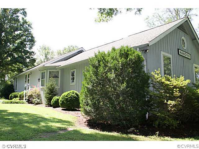 13003 Hanover Courthouse Road Hanover, VA 23069 - Photo 1 of 24 a view of a back yard of the house