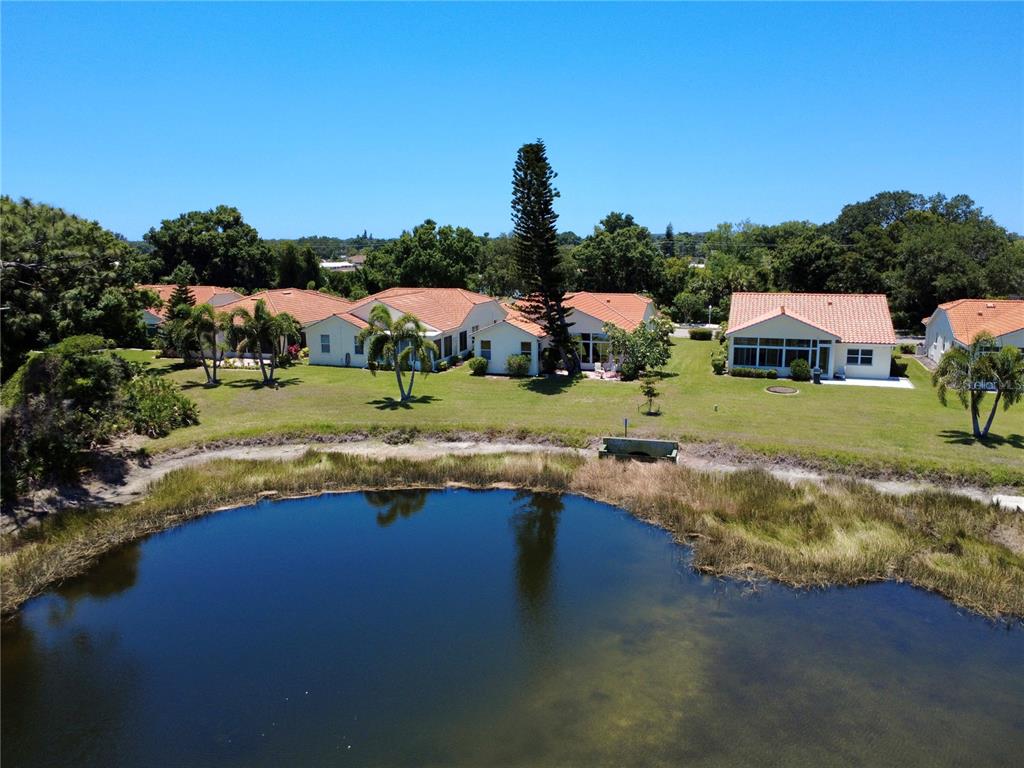 4266 Summertree Road Venice, FL 34293 - Photo 3 of 64 an aerial view of a house with a yard swimming pool and outdoor seating