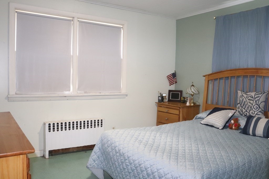35 Park Road Springfield, MA 01107 - Photo 11 of 23 a bedroom with a bed and dresser