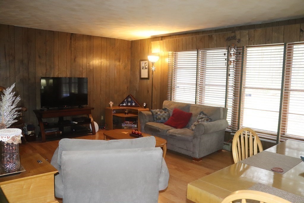 35 Park Road Springfield, MA 01107 - Photo 3 of 23 a living room with furniture and a flat screen tv