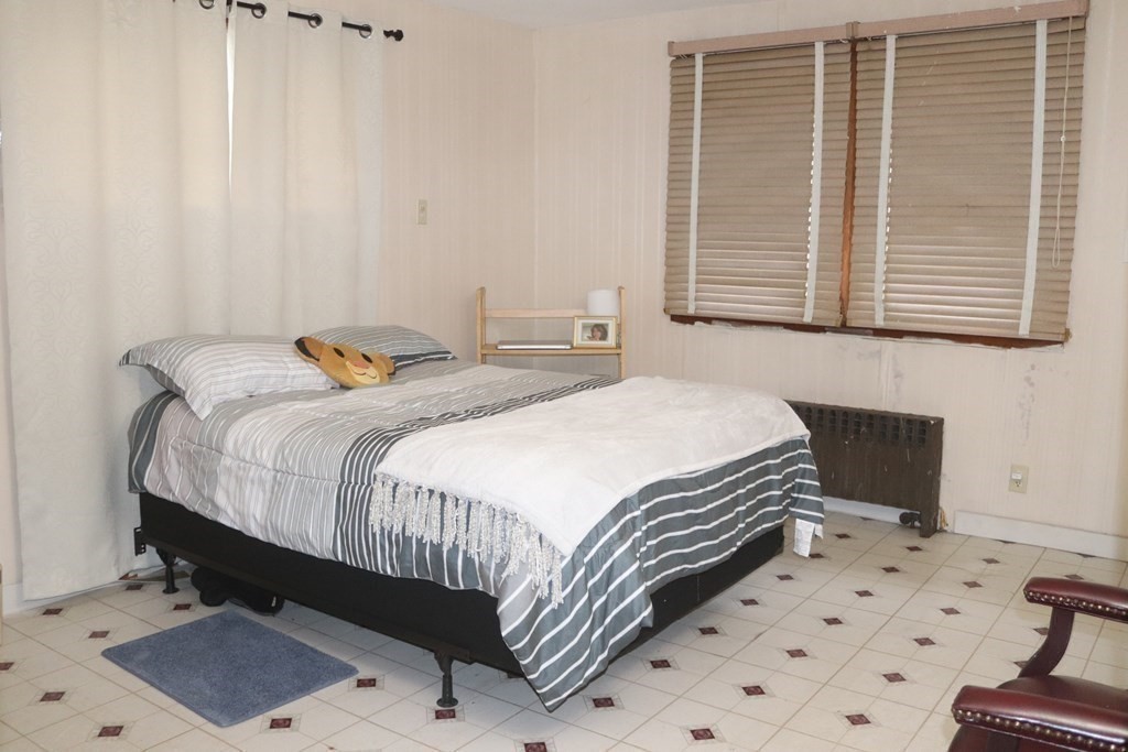 35 Park Road Springfield, MA 01107 - Photo 10 of 23 a bedroom with a bed and a window