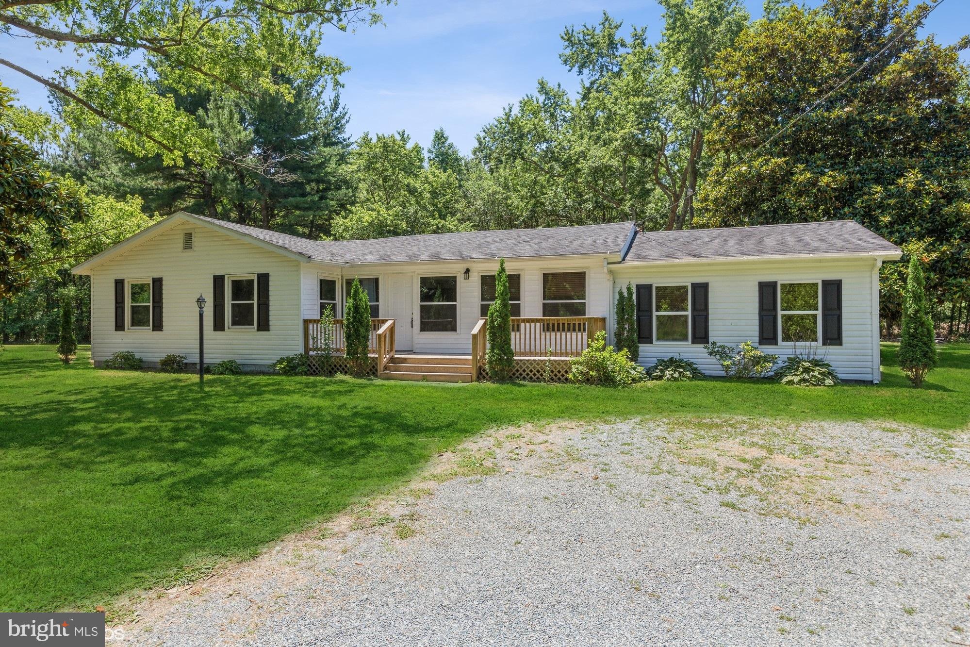 32593 Perryhawkin Road Princess Anne, MD 21853 - Photo 2 of 31 front view of a house with a yard