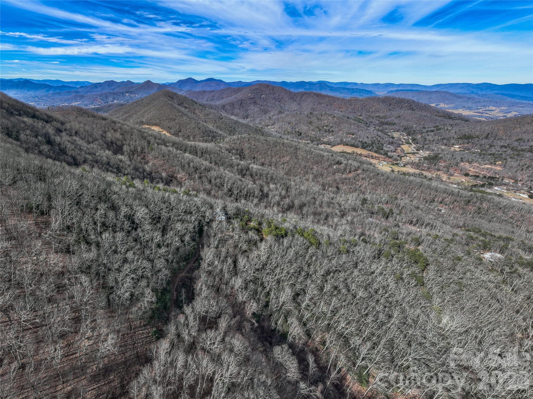 99999 High Top Mountain Road Leicester, NC 28748 - Photo 28 of 29 a view of a city with mountains in the background