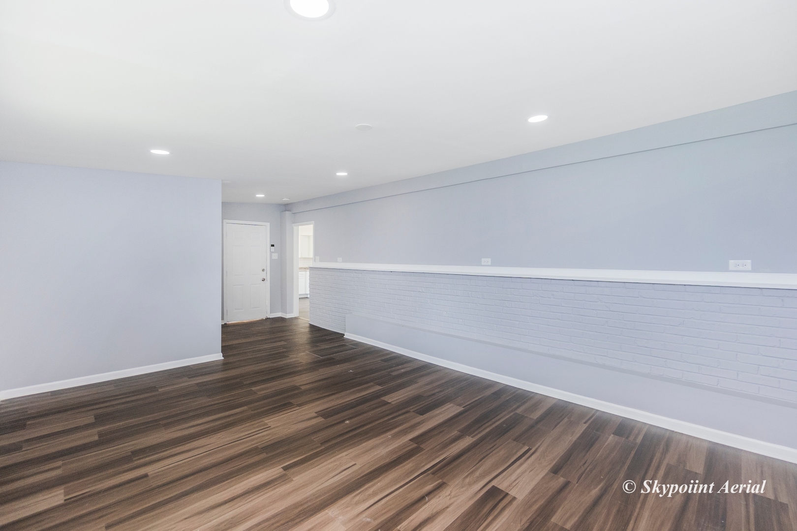 3145 Nottingham Avenue Markham, IL 60428 - Photo 13 of 27 a view of an empty room with wooden floor and a window