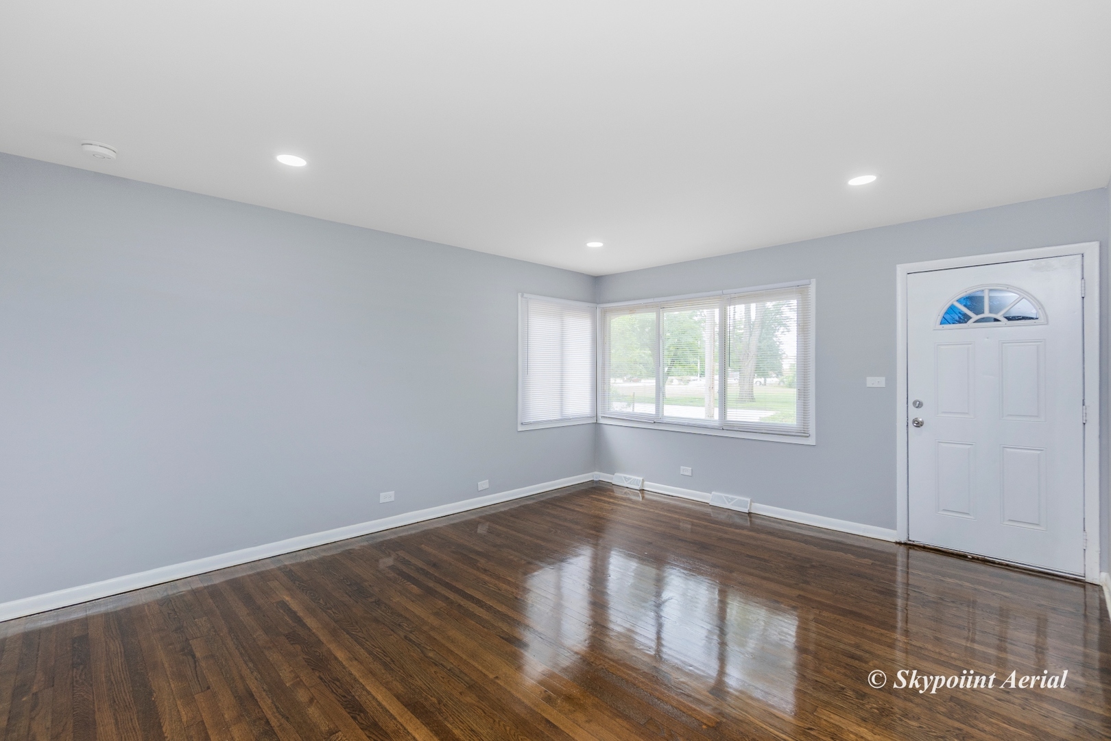 3145 Nottingham Avenue Markham, IL 60428 - Photo 6 of 27 a view of empty room with wooden floor and fan