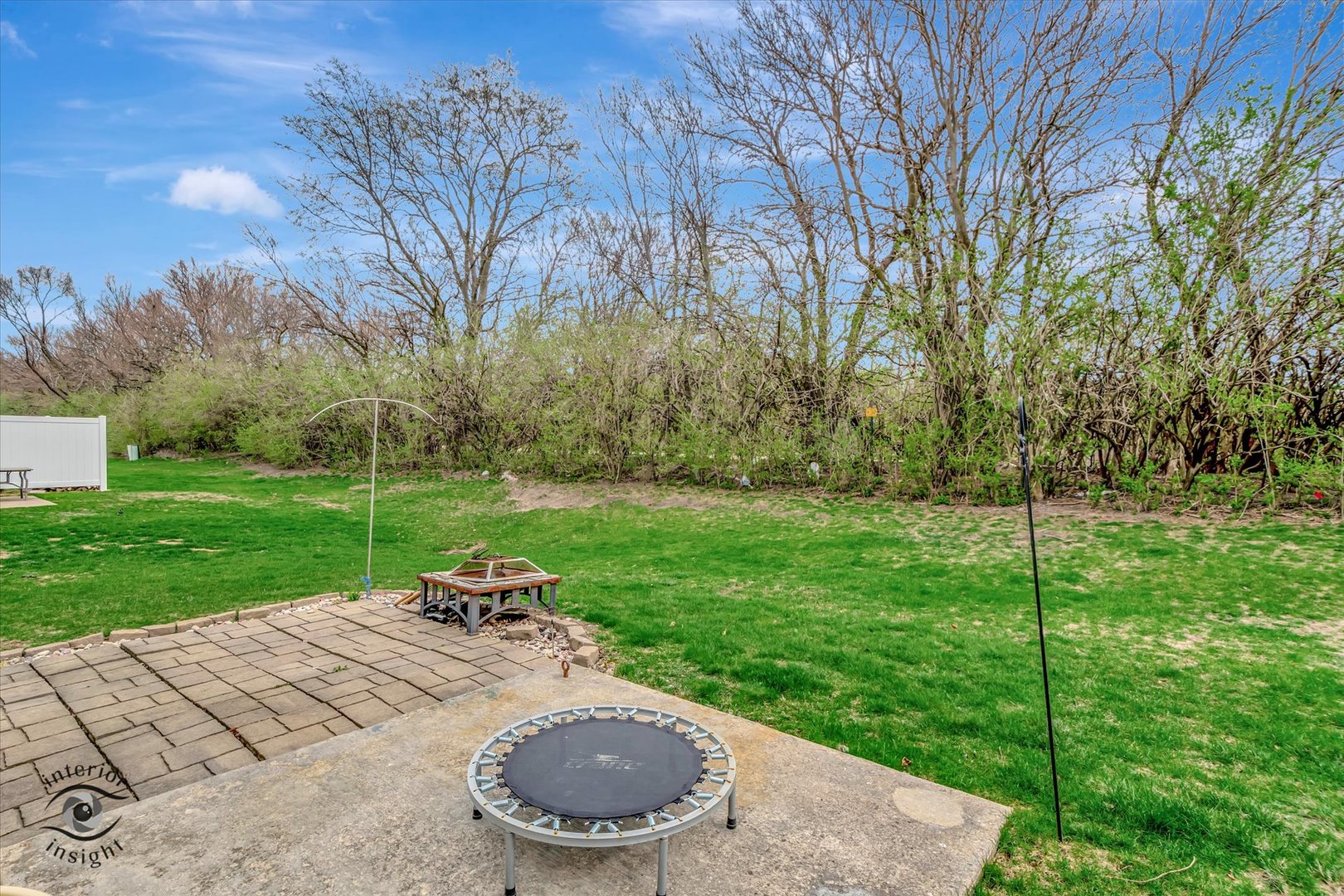 25219 Faraday Road Manhattan, IL 60442 - Photo 17 of 18 a view of a backyard with sitting area