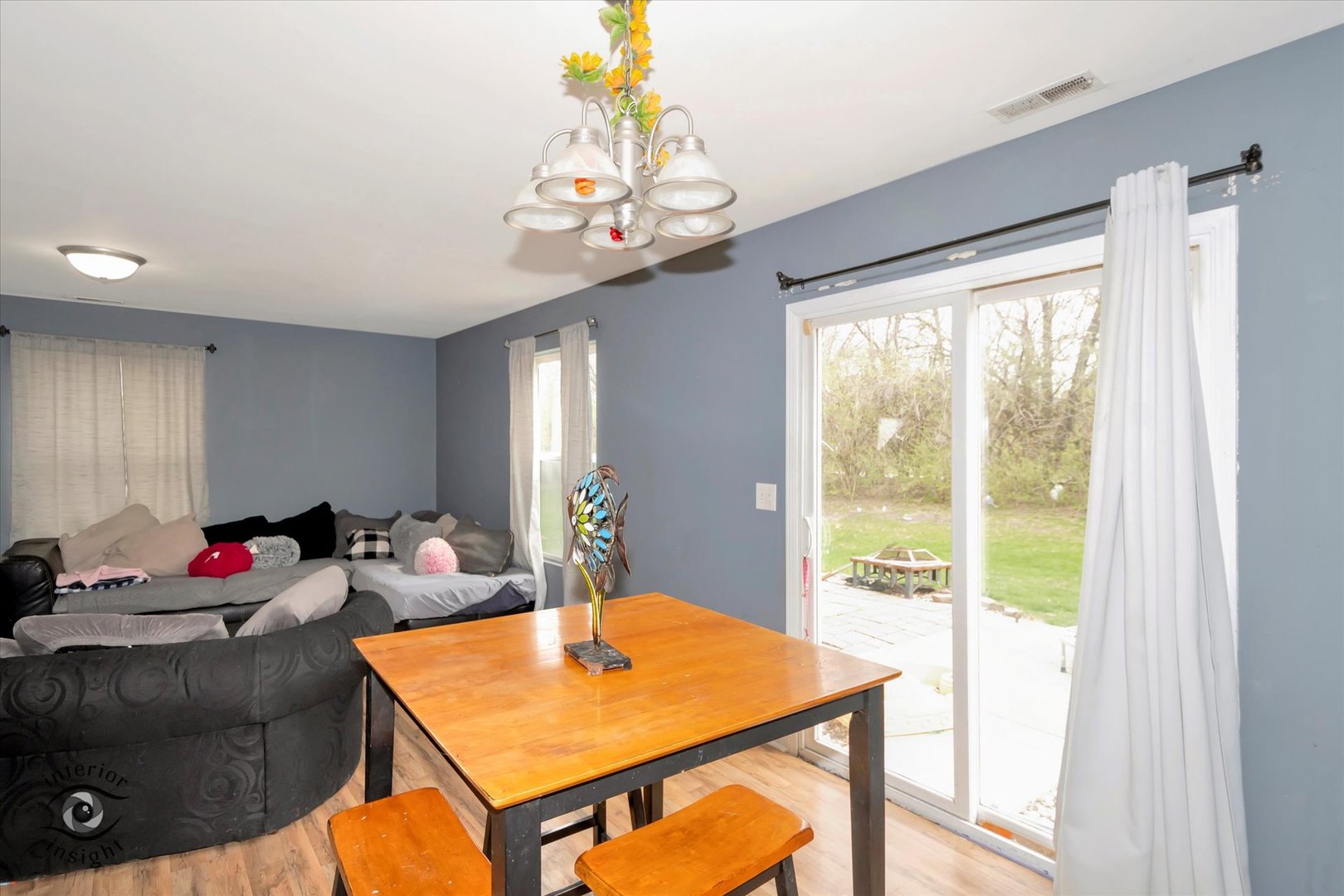 25219 Faraday Road Manhattan, IL 60442 - Photo 8 of 18 a view of a dining room with furniture window and a chandelier