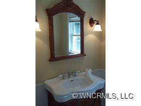 3790 Pigeon Road Waynesville, NC 28786 - Photo 14 of 24 a bathroom with a sink and a mirror