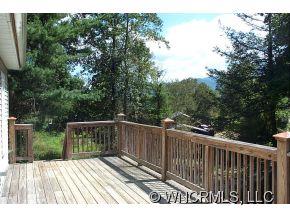 3790 Pigeon Road Waynesville, NC 28786 - Photo 22 of 24 a view of deck with wooden floor and fence