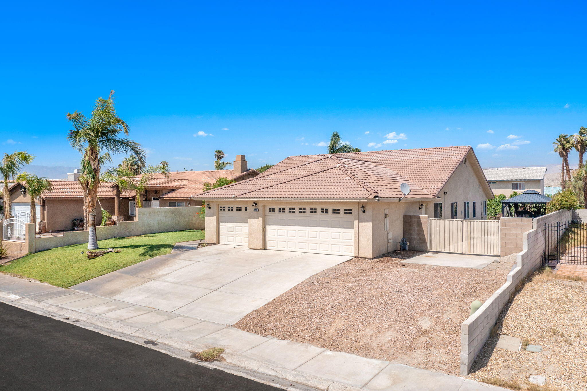68210 Empalmo Road Cathedral City, CA 92234 - Photo 2 of 34 a view of a house with a yard