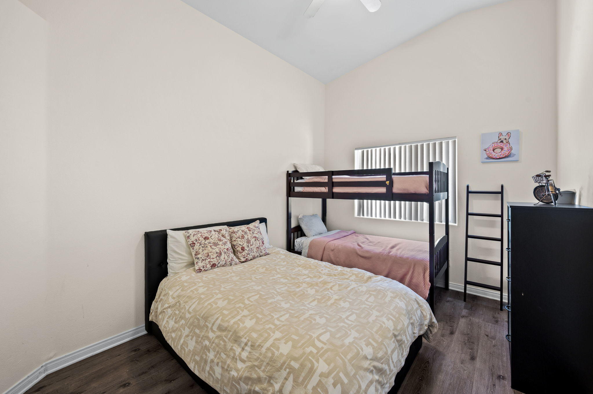 68210 Empalmo Road Cathedral City, CA 92234 - Photo 14 of 34 a bedroom with a bed and wooden floor