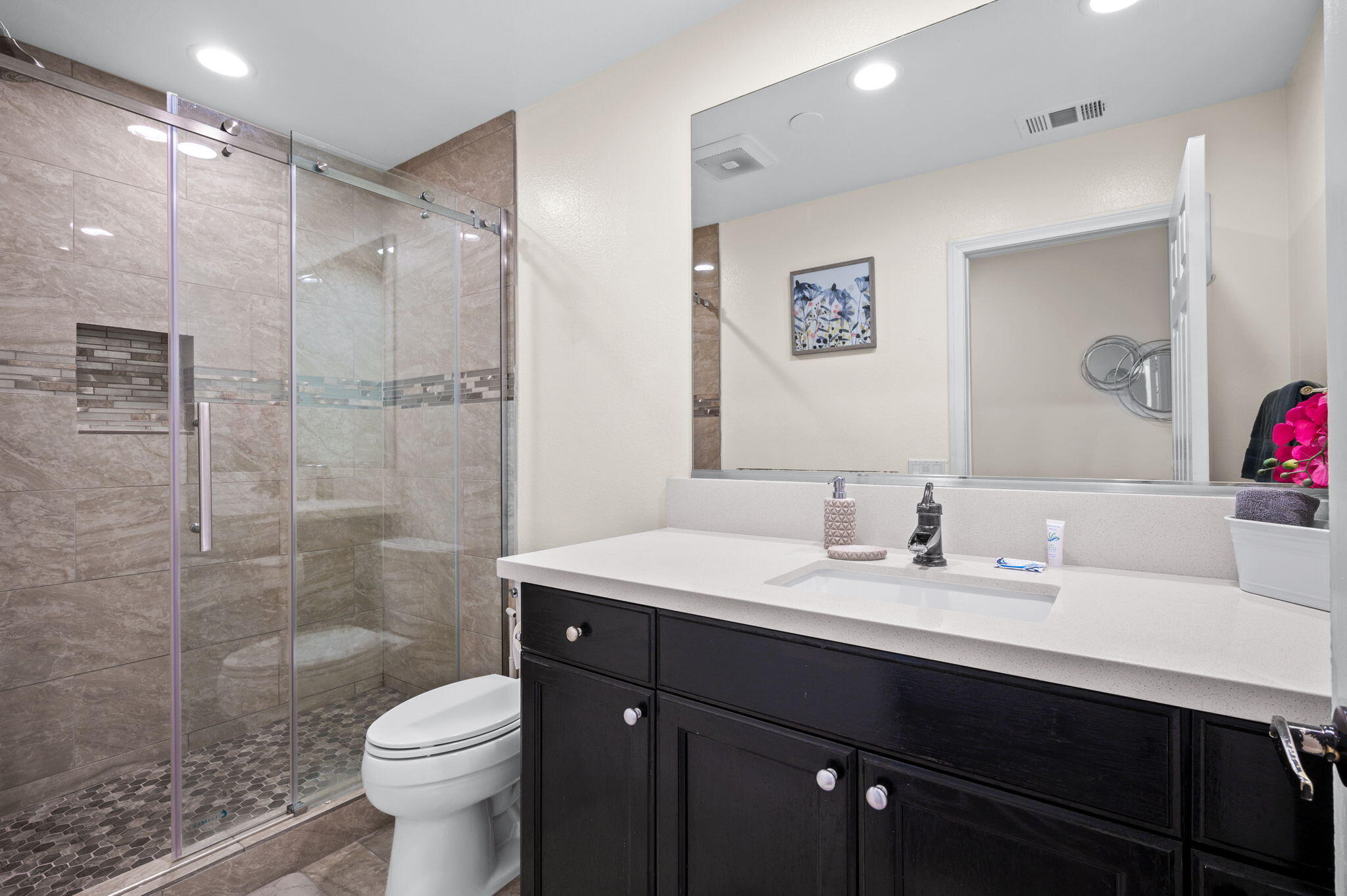 68210 Empalmo Road Cathedral City, CA 92234 - Photo 16 of 34 a bathroom with a sink toilet a mirror and shower