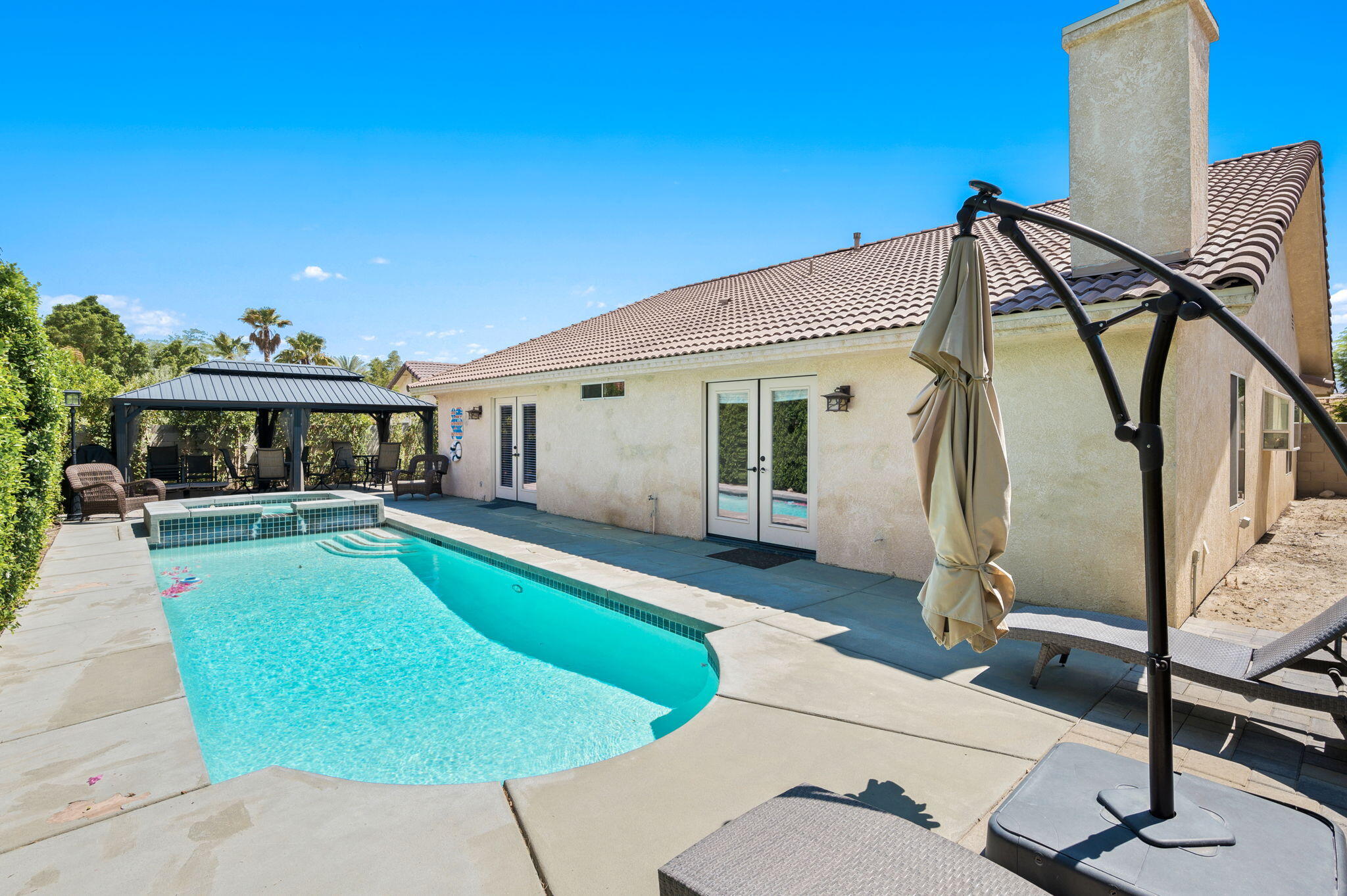 68210 Empalmo Road Cathedral City, CA 92234 - Photo 27 of 34 a view of house with swimming pool outdoor seating