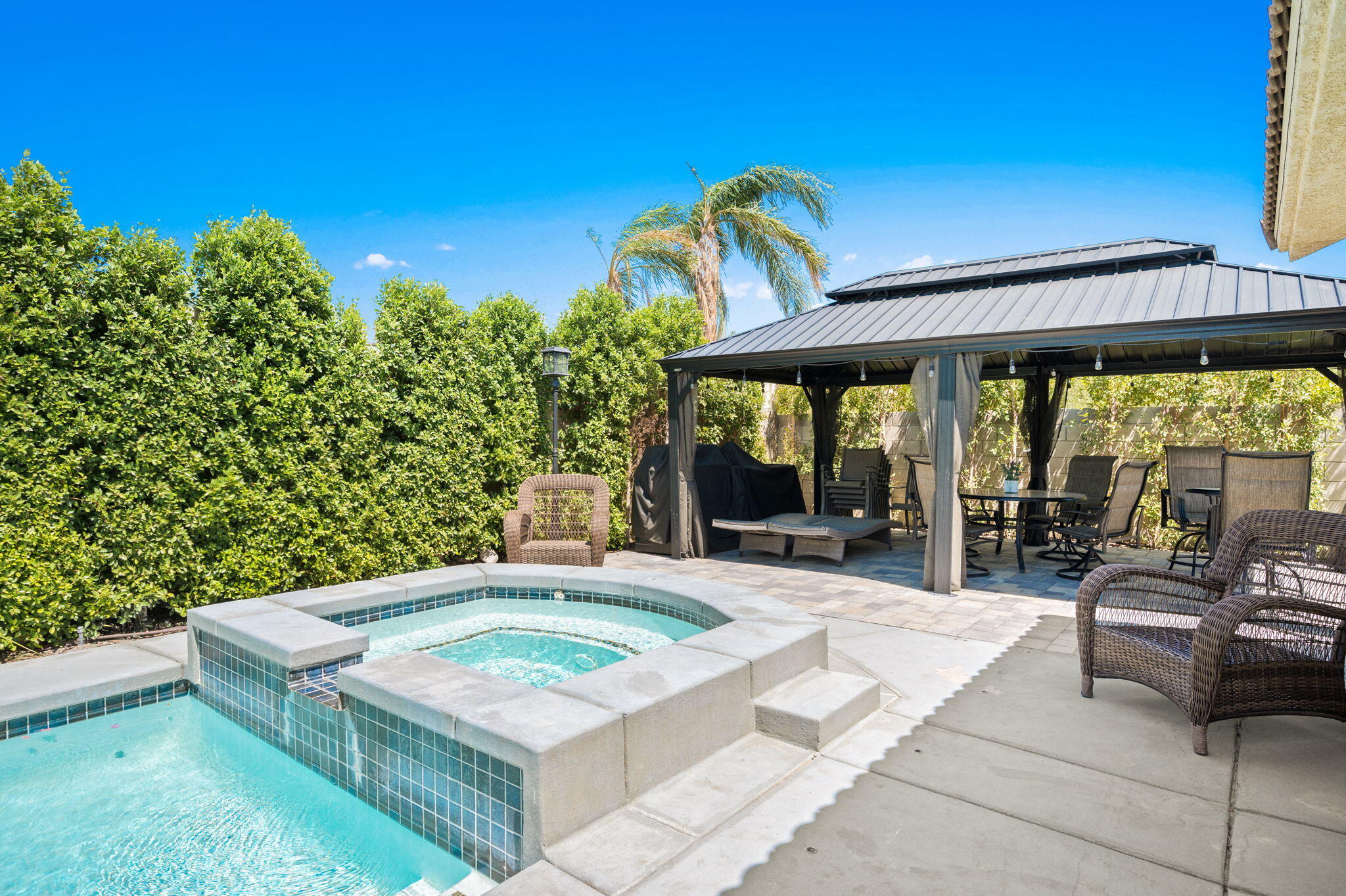 68210 Empalmo Road Cathedral City, CA 92234 - Photo 28 of 34 a view of a chairs and table in the patio and a yard