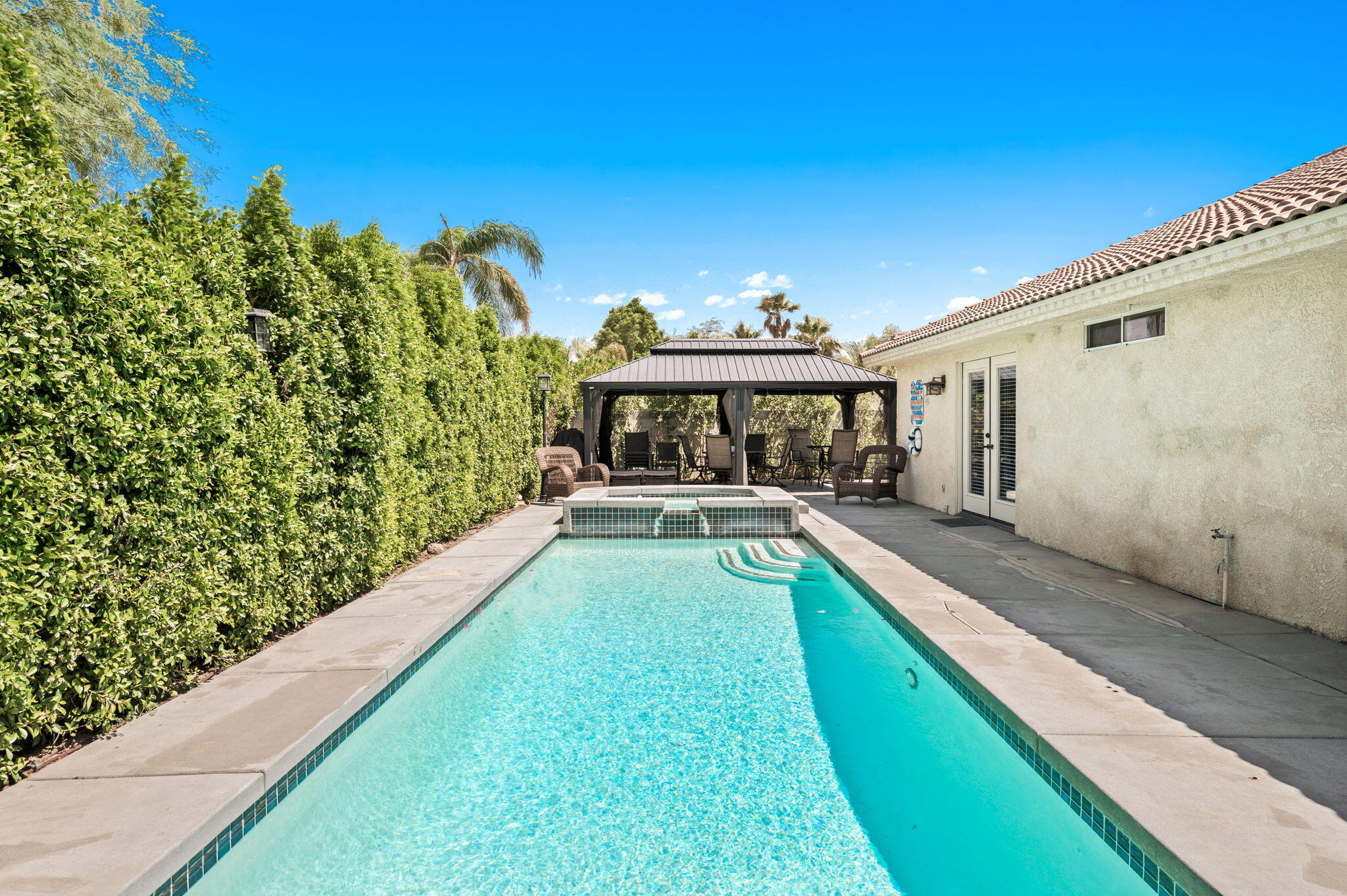 68210 Empalmo Road Cathedral City, CA 92234 - Photo 29 of 34 a view of a house with pool