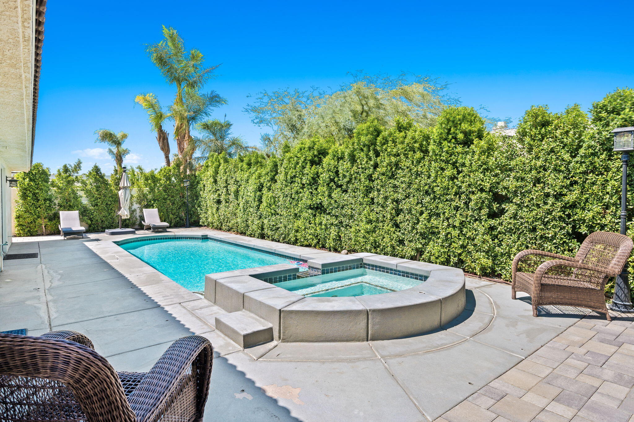 68210 Empalmo Road Cathedral City, CA 92234 - Photo 30 of 34 a view of a swimming pool with a patio and a yard