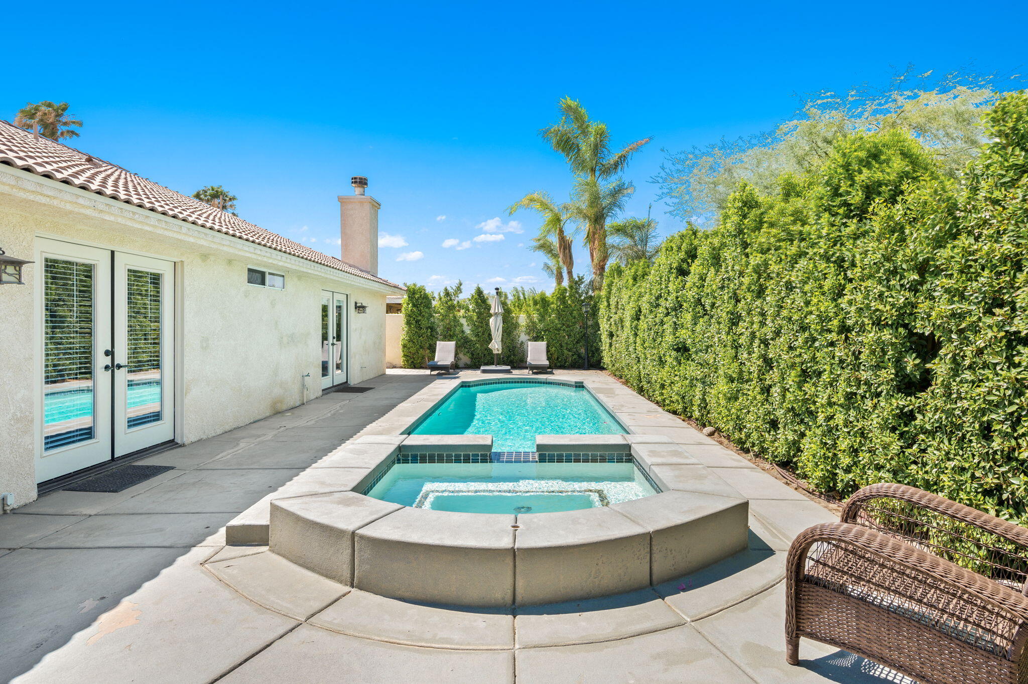 68210 Empalmo Road Cathedral City, CA 92234 - Photo 31 of 34 a view of a swimming pool with a patio
