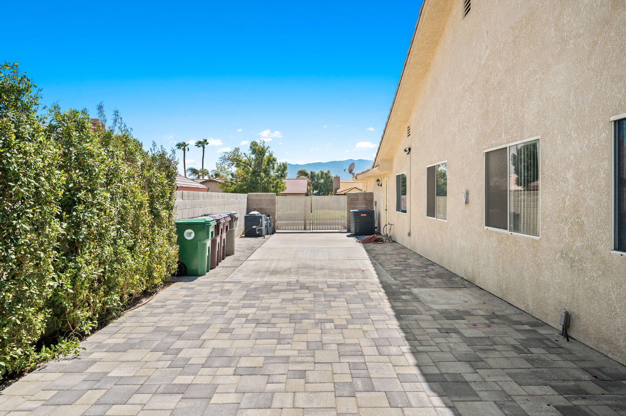 68210 Empalmo Road Cathedral City, CA 92234 - Photo 33 of 34 a view of a patio with couches potted plants and sky view