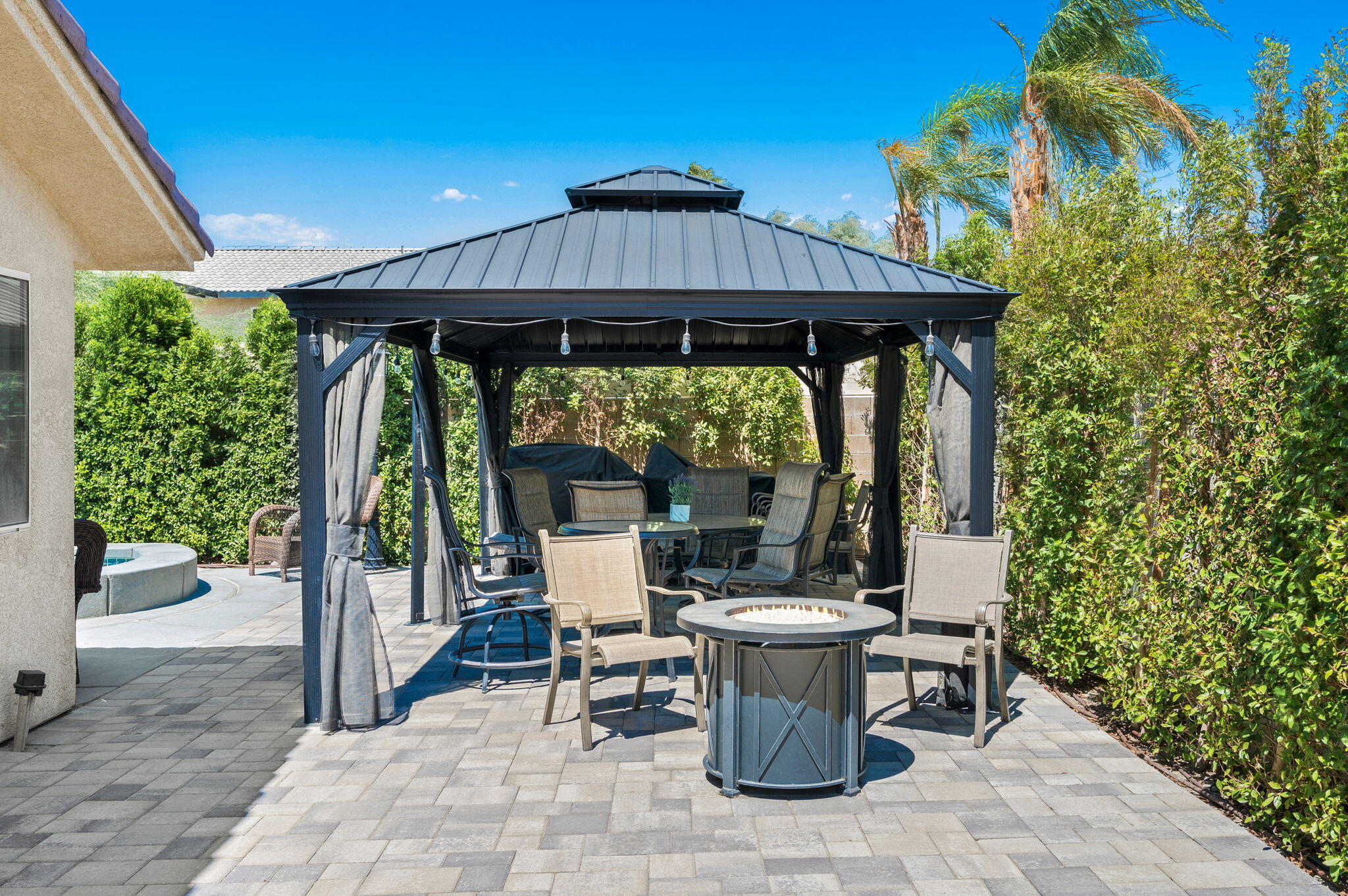 68210 Empalmo Road Cathedral City, CA 92234 - Photo 34 of 34 a view of a patio with table and chairs potted plants