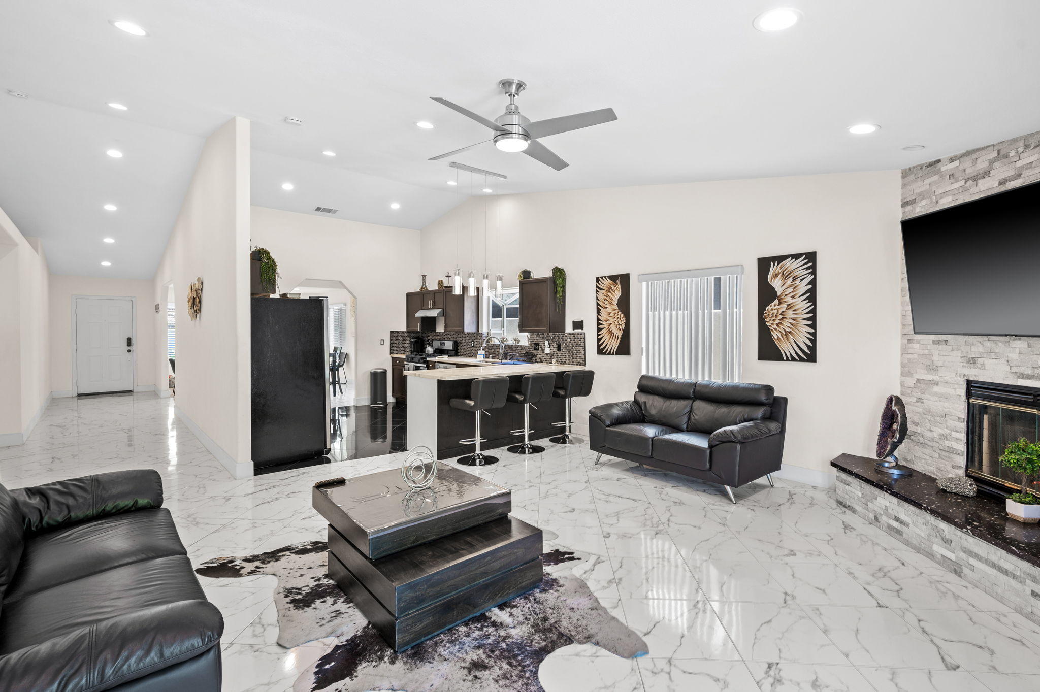 68210 Empalmo Road Cathedral City, CA 92234 - Photo 9 of 34 a living room with furniture and a fireplace