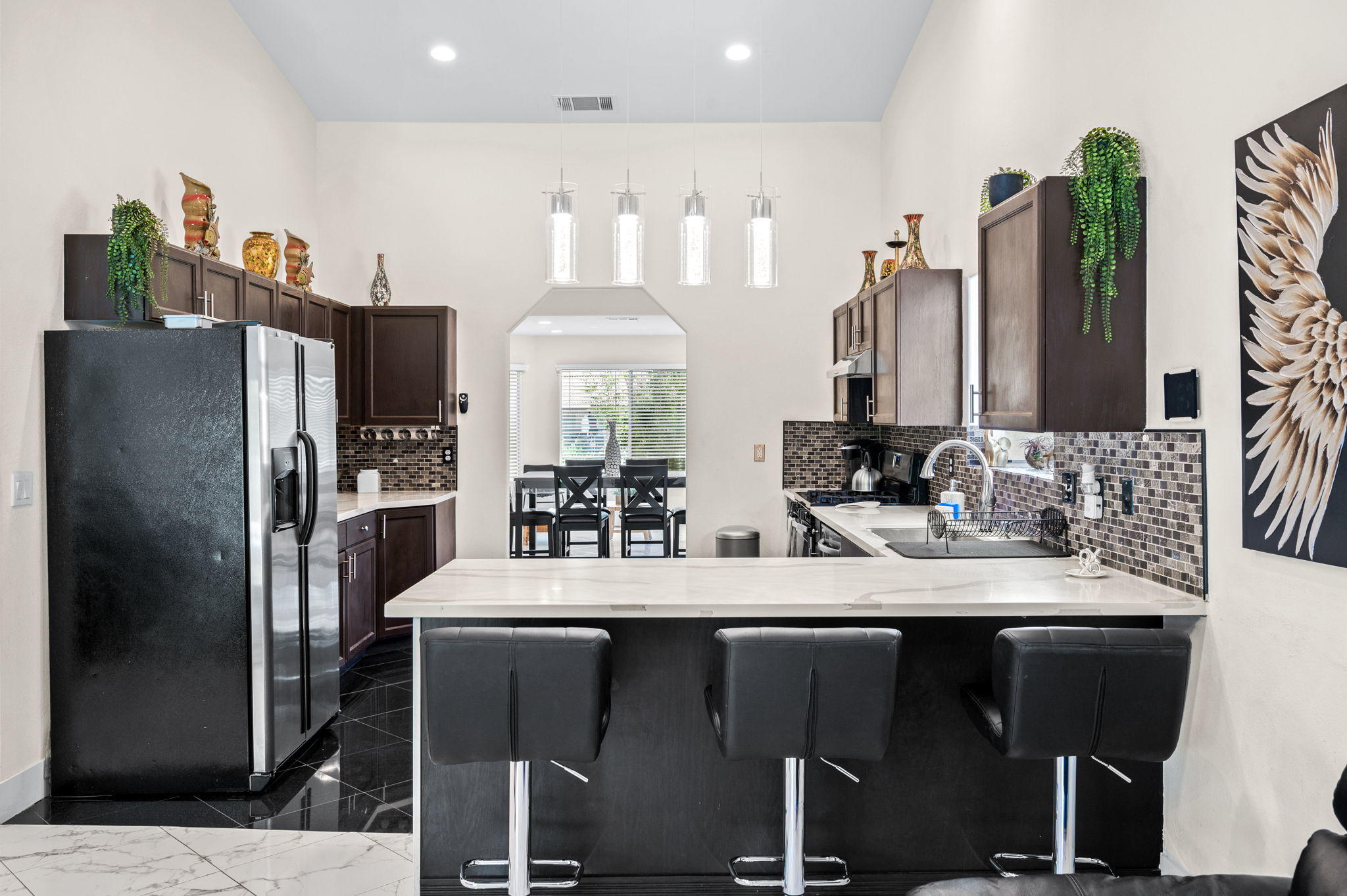 68210 Empalmo Road Cathedral City, CA 92234 - Photo 10 of 34 a kitchen with stainless steel appliances a refrigerator and sink
