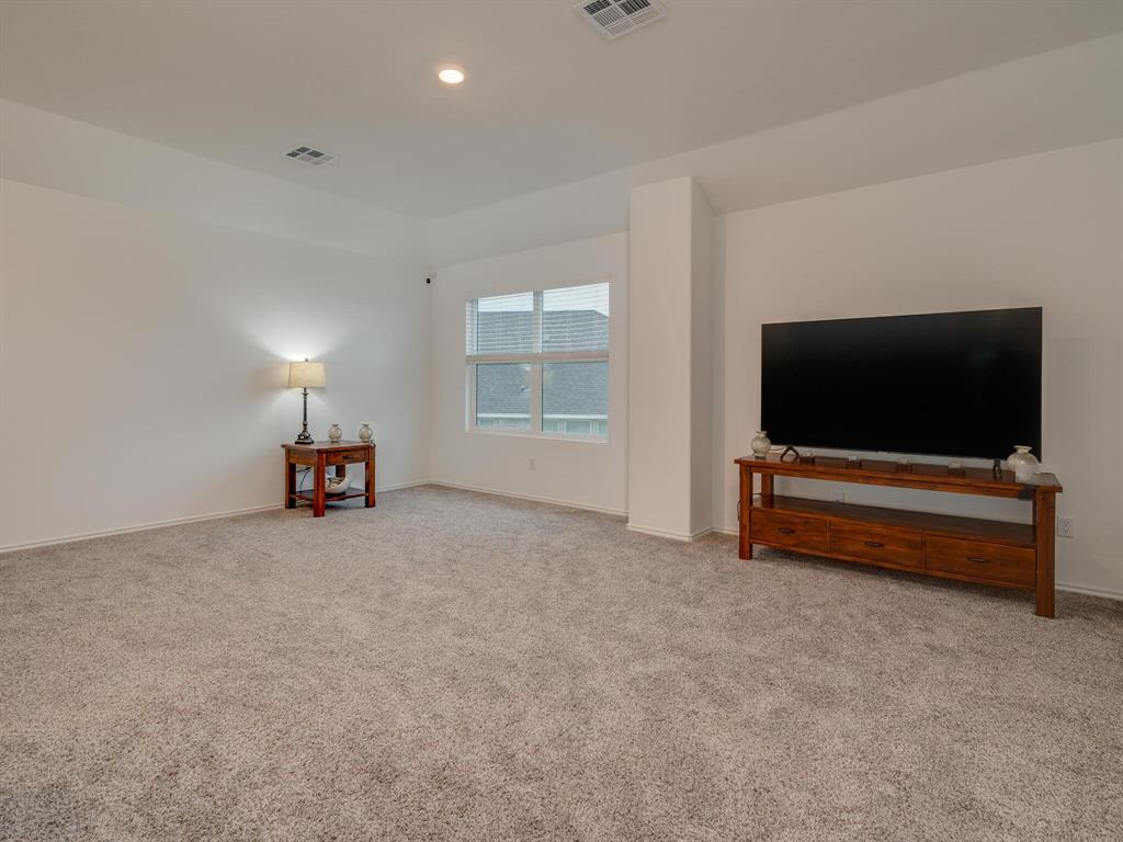 1208 Sweetspire Street Leander, TX 78641 - Photo 23 of 36 Spacious room featuring neutral carpeting and white walls
