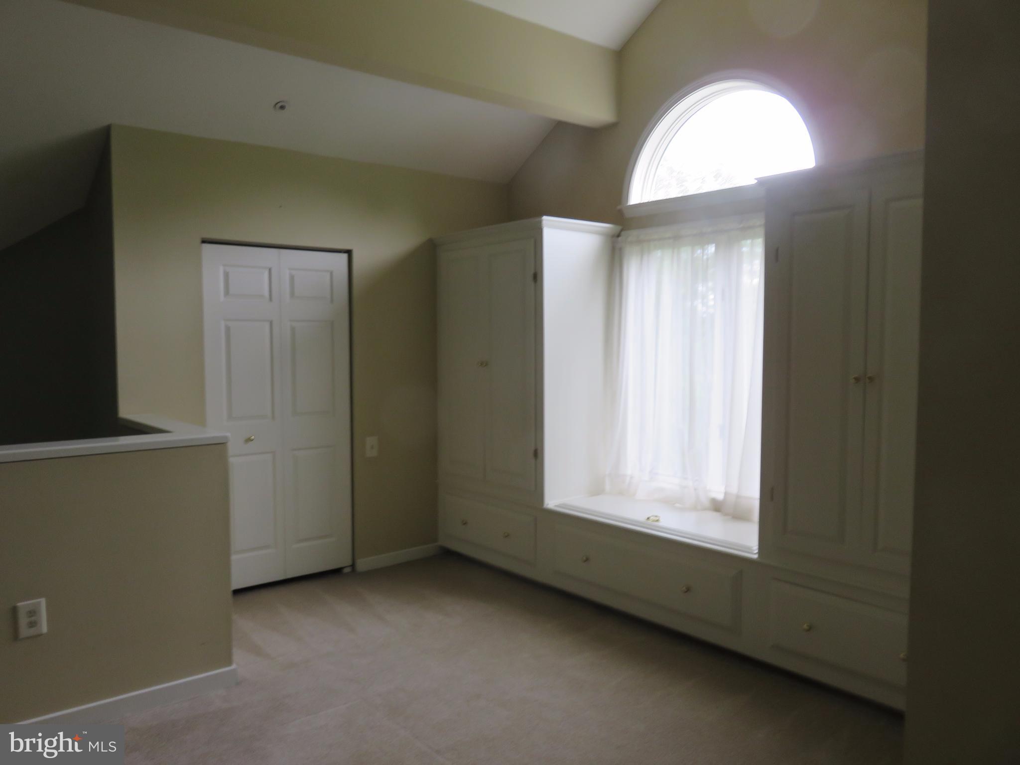 325 Pleasanton Road, Unit B24 Westminster, MD 21157 - Photo 14 of 17 Built-in wardrobe and window seat storage in loft.