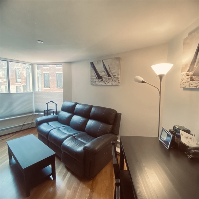 34 Hancock Street, Unit 1D Boston, MA 02114 - Photo 3 of 10 a living room with furniture and a window