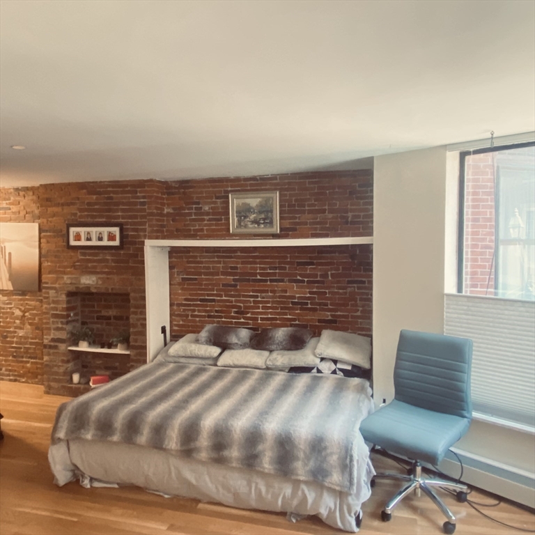 34 Hancock Street, Unit 1D Boston, MA 02114 - Photo 6 of 10 a view of a couch in the living room